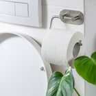 Uchwyt wieszak na papier toaletowy bez wiercenia samoprzylepny srebrny WC metalowy akcesorium łazienkowe montaż ścienny